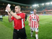 28 September 2006; Derry City coach Declan Devine and Darren Kelly leave the field at the end of the game. UEFA Cup, First round, Second leg, Paris St Germain v Derry City, Parc des Princes, Paris, France. Picture credit: Oliver McVeigh / SPORTSFILE