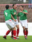 30 September 2006; Kyle Neil, Glentoran, celebrates with team-mates Philip Simpson, 4, and Sean Ward, right, after scoring a goal for his side. Carnegie Premier League, Glentoran v Ballymena United, The Oval, Belfast. Picture credit: Russell Pritchard / SPORTSFILE
