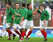 30 September 2006; Glentoran's Kyle Neil acknowledges the crowd as he celebrates with team-mates, from left, Willow McDonagh, Michael Halliday, Sean Ward and Gary Hamilton, 10, after scoring a goal for his side. Carnegie Premier League, Glentoran v Ballymena United, The Oval, Belfast. Picture credit: Russell Pritchard / SPORTSFILE