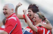 1 October 2006; Mary O'Connor, right, Cork, celebrates with team-mate Caoimhe Creedon and coach Eamonn Ryan at the end of the game. TG4 Ladies All-Ireland Senior Football Championship Final, Cork v Armagh, Croke Park, Dublin. Picture credit: David Maher / SPORTSFILE