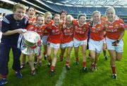 1 October 2006; Cork Liasion Officer Eileen O'Brien, left, celebrates with players, from left, Ciara Walsh, Briege Corkery, Angela Walsh, Mary O'Conor, Caoimhe Creedon, Elaine O'Riordan, Valrie Mulcahy, Sinead O'Reilly and Brid Stack, and the Brendan Martin Cup after the game. TG4 Ladies All-Ireland Senior Football Championship Final, Cork v Armagh, Croke Park, Dublin. Picture credit: Brendan Moran / SPORTSFILE