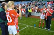 1 October 2006; Nollaig Cleary, 10, Cork, takes a photo of coach Eamonn Ryan and captain Juliet Murphy with the Brendan Martin Cup after the game. TG4 Ladies All-Ireland Senior Football Championship Final, Cork v Armagh, Croke Park, Dublin. Picture credit: Brendan Moran / SPORTSFILE
