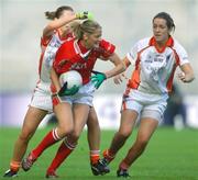 1 October 2006; Juliet Murphy, Cork, in action against Sinead McCleary, left, and Caroline O'Hanlon, Armagh. TG4 Ladies All-Ireland Senior Football Championship Final, Cork v Armagh, Croke Park, Dublin. Picture credit: David Maher / SPORTSFILE