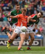 3 August 2014; Oisín O'Neill, Armagh, in action against David Clarke, left, and Stephen Brennan, Mayo. Electric Ireland GAA Football All Ireland Minor Championship, Quarter-Final, Mayo v Armagh, Croke Park, Dublin. Picture credit: Ray McManus / SPORTSFILE