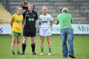 4 August 2014; Team captains Eilish Ward, left, Donegal, and Bernie Breen, Kerry, stand for a photograph in the company of referee Des McEnery. TG4 All-Ireland Ladies Football Senior Championship Round 2 Qualifier, Donegal v Kerry, St Brendan's Park, Birr, Co. Offaly. Picture credit: Brendan Moran / SPORTSFILE