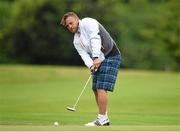 8 August 2014; Ian Madigan watches his watches his putt on the 18th green during the IRUPA Rugby Players’ Classic at Powerscourt Golf Club. Hosted by Powerscourt Resort & Spa, more than 20 players joined corporate teams to take on the West Course in a break from their hectic pre-season schedule. Attending players, past and current included, Rob Kearney, Jimmy Gopperth, Ian Madigan, Fergus McFadden, Shane Jennings, Zane Kirchner, Brendan Macken, Rhys Ruddock, Alan Quinlan, Doug Howlett and many more. Guests were treated to a Q&A with IRUPA Chairman Rob Kearney. IRUPA Rugby Players Golf Classic, Powerscourt Golf Club, Enniskerry, Co. Wicklow. Picture credit: Matt Browne / SPORTSFILE