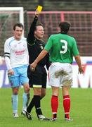 30 September 2006; Ballymena United's Albert Watson watches as Referee Adrian McCourt shows the Yellow Card to Glentorans Kyle Neil. Carnegie Premier League, Glentoran v Ballymena United, The Oval, Belfast. Picture credit: Russell Pritchard / SPORTSFILE