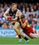 9 August 2014; Carlton's Ciaran Sheehan during his AFL debut is tackled by David Swallow, Gold Coast Suns. 2014 Toyota AFL Premiership, Round 20, Carlton Blues v Gold Coast Suns, Etihad Stadium, Melbourne, Australia. Picture credit: Greg Ford / SPORTSFILE