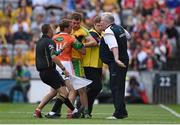 9 August 2014; Armagh manager Paul Grimley and assistant Kieran McGeeney with player Kevin Dyas exchange views with Eamonn McGee, Donegal. GAA Football All-Ireland Senior Championship, Quarter-Final, Donegal v Armagh, Croke Park, Dublin. Picture credit: Stephen McCarthy / SPORTSFILE