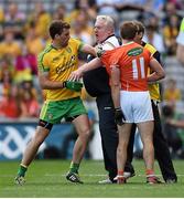 9 August 2014; Armagh manager Paul Grimley and assistant Kieran McGeeney with player Kevin Dyas exchange views with Eamonn McGee, Donegal. GAA Football All-Ireland Senior Championship, Quarter-Final, Donegal v Armagh, Croke Park, Dublin. Picture credit: Stephen McCarthy / SPORTSFILE