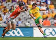 9 August 2014; Odhrán MacNiallais, Donegal, scores his side's first goal despite the attention of Aaron Findon, Armagh. GAA Football All-Ireland Senior Championship, Quarter-Final, Donegal v Armagh, Croke Park, Dublin. Picture credit: Stephen McCarthy / SPORTSFILE