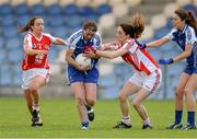 9 August 2014; Niamh Kindlon, Monaghan, in action against Carol Dooher and Laura McGillion, Tyrone. TG4 All-Ireland Ladies Football Senior Championship, Round 2 Qualifier, Monaghan v Tyrone, Pearse Park, Longford. Picture credit: Oliver McVeigh / SPORTSFILE