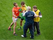 9 August 2014; Éamonn McGee, Donegal, intercepts Armagh manager Paul Grimley's attempt to get a message to Kevin Dyas. GAA Football All-Ireland Senior Championship, Quarter-Final, Donegal v Armagh, Croke Park, Dublin. Picture credit: Dáire Brennan / SPORTSFILE