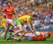 9 August 2014; Leo McLoone, Donegal, in action against Brendan Donaghy, Armagh. GAA Football All-Ireland Senior Championship, Quarter-Final, Donegal v Armagh, Croke Park, Dublin. Picture credit: Ray McManus / SPORTSFILE