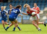 9 August 2014; Neamh Woods, Tyrone, in action against Cathriona McConnell, Monaghan. TG4 All-Ireland Ladies Football Senior Championship, Round 2 Qualifier, Monaghan v Tyrone, Pearse Park, Longford. Picture credit: Oliver McVeigh / SPORTSFILE