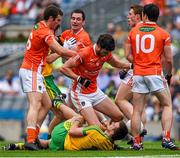9 August 2014; Players from both sides including Leo McLoone, Donegal, and Aaron Findon, Armagh, during a first half altercation. GAA Football All-Ireland Senior Championship, Quarter-Final, Donegal v Armagh, Croke Park, Dublin. Picture credit: Ray McManus / SPORTSFILE