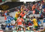 9 August 2014; Stephen Harold, Armagh, in action against Neil Gallagher, left, and Rory Kavanagh, Donegal. GAA Football All-Ireland Senior Championship, Quarter-Final, Donegal v Armagh, Croke Park, Dublin. Photo by Sportsfile