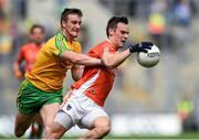 9 August 2014; Mark Shields, Armagh, in action against Leo McLoone, Donegal. GAA Football All-Ireland Senior Championship, Quarter-Final, Donegal v Armagh, Croke Park, Dublin. Photo by Sportsfile