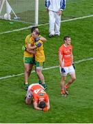 9 August 2014; Rory Kavanagh, left, and Anthony Thompson, Donegal, celebrate, while Ethan Rafferty, Armagh, falls to the ground at the final whistle. GAA Football All-Ireland Senior Championship, Quarter-Final, Donegal v Armagh, Croke Park, Dublin. Picture credit: Dáire Brennan / SPORTSFILE