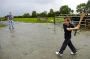 4 October 2006; Galway’s double success in 2006 was recognised at the official launch of the 2006/7 AIB Club Championships. Photographed at the Canning’s family farm in Portumna, Galway, is Jack Canning, age 7, playing hurling with his uncle Joe. Picture credit: Brendan Moran / SPORTSFILE