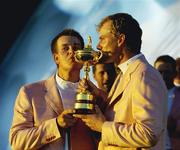 24 September 2006; Henrik Stenson, left, and Robert Karlsson, Team Europe 2006, kiss the Ryder Cup after they defeated the USA. 36th Ryder Cup Matches, K Club, Straffan, Co. Kildare, Ireland. Picture credit: Matt Browne / SPORTSFILE