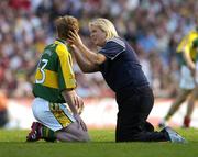 17 September 2006; Kerry team physio Sarah Hobbs attends to Colm Cooper during the second half. Bank of Ireland All-Ireland Senior Football Championship Final, Kerry v Mayo, Croke Park, Dublin. Picture credit: Brendan Moran / SPORTSFILE