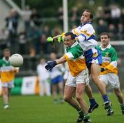 8 October 2006; Ronan McGarrity, Carrickmore, in action against Pascal Canavan, Errigal Ciaran. WJ Dolan Tyrone Senior Football Championship Final Replay, Errigal Ciaran v Carrickmore, Healy Park, Omagh, Co Tyrone. Picture credit: Oliver McVeigh / SPORTSFILE