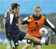 10 October 2006; Andy Reid, in against his team-mate Damien Duff, during Republic of Ireland squad training. Lansdowne Road, Dublin. Picture credit: David Maher / SPORTSFILE