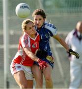 9 August 2014; Gemma Begley, Tyrone, in action against Eimear O'Rourke, Monaghan. TG4 All-Ireland Ladies Football Senior Championship, Round 2 Qualifier, Monaghan v Tyrone, Pearse Park, Longford. Picture credit: Oliver McVeigh / SPORTSFILE