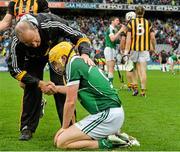 10 August 2014; A dejected Paul Browne, Limerick, is consoled by Kilkenny selector Michael Dempsey, at the end of the game. GAA Hurling All-Ireland Senior Championship, Semi-Final, Kilkenny v Limerick, Croke Park, Dublin. Picture credit: David Maher / SPORTSFILE