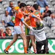 9 August 2014; Donegal team doctor Kevin Moran tries to seperate Armagh's Aaron Findon, left, from Aidan Forker and Donegal's Karl Lacey. GAA Football All-Ireland Senior Championship, Quarter-Final, Donegal v Armagh, Croke Park, Dublin. Picture credit: Stephen McCarthy / SPORTSFILE