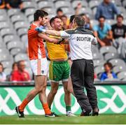 9 August 2014; Donegal team doctor Kevin Moran tries to seperate Armagh's Aaron Findon, left, and Aidan Forker from Donegal's Karl Lacey. GAA Football All-Ireland Senior Championship, Quarter-Final, Donegal v Armagh, Croke Park, Dublin. Picture credit: Stephen McCarthy / SPORTSFILE