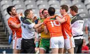9 August 2014; Donegal team doctor Kevin Moran tries to seperate Armagh's Aaron Findon, left, Aidan Forker and Finnian Moriarty, right, from Donegal's Karl Lacey. GAA Football All-Ireland Senior Championship, Quarter-Final, Donegal v Armagh, Croke Park, Dublin. Picture credit: Stephen McCarthy / SPORTSFILE