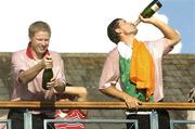 24 September 2006; Padraig Harrington, Team Europe 2006, drinks champagne as his caddy Ronan Flood opens another magnum on the balcony of the clubhouse after victory over the USA. 36th Ryder Cup Matches, K Club, Straffan, Co. Kildare, Ireland. Picture credit: Brendan Moran / SPORTSFILE