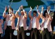 24 September 2006; Team Europe 2006 players, from left, Robert Karlsson, David Howell, Padraig Harrington and Sergio Garcia applaud the crowd during the Closing Ceremony. 36th Ryder Cup Matches, K Club, Straffan, Co. Kildare, Ireland. Picture credit: Matt Browne / SPORTSFILE