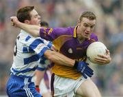 15 October 2006; Richie Brady, Wolfe Tones, in action against Stephen Bray, Navan O'Mahonys. Meath Senior Football C. Meath Senior Football Championship Final, Navan O'Mahonys v Wolfe Tones, Pairc Tailteann, Navan, Co. Meath. Picture credit: David Maher / SPORTSFILE