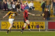 15 October 2006; Rory Jacob, Oulart-the-Ballagh, shoots to score the point which levelled the game despite the challenge of Anthony O'Connell, Rathnure. Wexford Senior Hurling Championship Final, Oulart-the-Ballagh v Rathnure, Wexford Park, Co. Wexford. Picture credit: Pat Murphy / SPORTSFILE