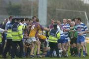 15 October 2006; Players and officials from both Navan O'Mahonys and Wolfe Tones, confront each other as members of the Gardai steps in. Meath Senior Football Championship Final, Navan O'Mahonys v Wolfe Tones, Pairc Tailteann, Navan, Co. Meath. Picture credit: David Maher / SPORTSFILE