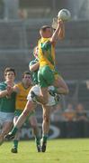15 October 2006; Aian Donnellan, Corofin, in action against Damien Cunniffe, Caltra. Galway Senior Football Championship Final, Caltra v Corofin, Pearse Stadium, Galway. Picture credit: Ray Ryan / SPORTSFILE