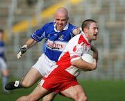 15 October 2006; Gavin Brown, Lamh Dhearg, in action against Gareth Clarke, St. John's. Antrim Senior Football Championship Semi-Final Replay, Lamh Dhearg v St. John's, Casement Park, Belfast, Co. Antrim. Picture credit: Oliver McVeigh / SPORTSFILE