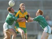 15 October 2006; Greg Higgins, Corofin, in action against Damien Cunniffe and Paul Gately, Caltra. Galway Senior Football Championship Final, Caltra v Corofin, Pearse Stadium, Galway. Picture credit: Ray Ryan / SPORTSFILE