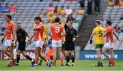 9 August 2014; Referee Joe McQuillan issues a yellow card to Aaron Findon, Armagh. GAA Football All-Ireland Senior Championship, Quarter-Final, Donegal v Armagh, Croke Park, Dublin. Picture credit: Stephen McCarthy / SPORTSFILE