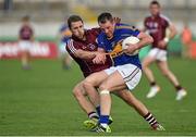 26 July 2014; Peter Acheson, Tipperary, in action against Michael Lundy, Galway. GAA Football All Ireland Senior Championship, Round 4A, Galway v Tipperary. O'Connor Park, Tullamore, Co. Offaly. Picture credit: Barry Cregg / SPORTSFILE
