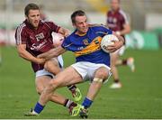 26 July 2014; Peter Acheson, Tipperary, in action against Michael Lundy, Galway. GAA Football All Ireland Senior Championship, Round 4A, Galway v Tipperary. O'Connor Park, Tullamore, Co. Offaly. Picture credit: Barry Cregg / SPORTSFILE