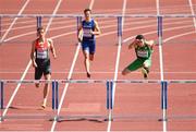 12 August 2014; Ireland's Thomas Barr, right, jumps the final hurdle on his way to winning his heat of the men's 400m hurdle event, in a time of 49.79. European Athletics Championships 2014 - Day 1. Letzigrund Stadium, Zurich, Switzerland. Picture credit: Stephen McCarthy / SPORTSFILE