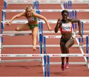 12 August 2014; Ireland's Sarah Lavin during her heat of the women's 100m hurdle event, where she finished 8th in a time of 13.35. Also pictured is heat winner Anne Zagré of Belgium. European Athletics Championships 2014 - Day 1. Letzigrund Stadium, Zurich, Switzerland. Picture credit: Stephen McCarthy / SPORTSFILE