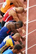 12 August 2014; Athletes, including Great Britain's Dwane Chambers, centre, take their marks for their heat of the Men's 100m. European Athletics Championships 2014 - Day 1. Letzigrund Stadium, Zurich, Switzerland. Picture credit: Stephen McCarthy / SPORTSFILE