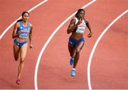 12 August 2014; Christine Ohuruogo of Great Britain on her way to winning her heat of the women's 400m, with a time of 51.40. Also pictured is Libania Grenot of Italy, who finished second with a time of 51.90. European Athletics Championships 2014 - Day 1. Letzigrund Stadium, Zurich, Switzerland. Picture credit: Stephen McCarthy / SPORTSFILE