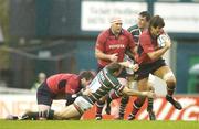 22 October 2006; Donncha O'Callaghan, Munster, breaks through the tackle of Leicester Tigers' Scott Bemand on his way to scoring his side's first try. Heineken Cup 2006-2007, Pool 4, Round 1, Leicester Tigers v Munster, Welford Road, Leicester, England. Picture credit: Pat Murphy / SPORTSFILE