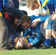 22 October 2006; Loughrea's Brian Mahony lies on the ground as team-mates celebrate after the final whistle. Galway Senior Hurling Championship Final, Portumna v Loughrea, Pearse Stadium, Galway. Picture credit: Ray Ryan / SPORTSFILE